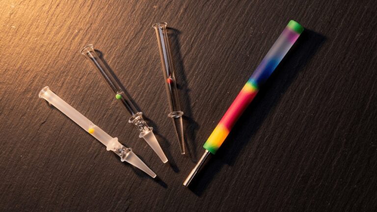 Four dab straw tip materials — glass, quartz, titanium, and silicone
