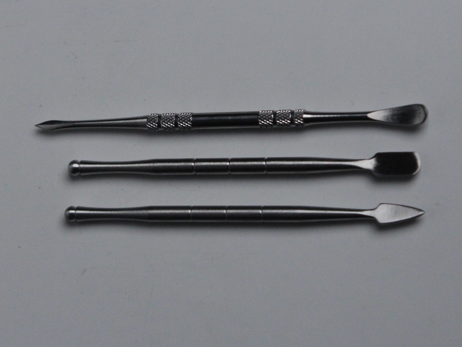 Roots Glass stainless dab tools, top to bottom: Spoon with a pick on the back end, Shovel, and Arrow
